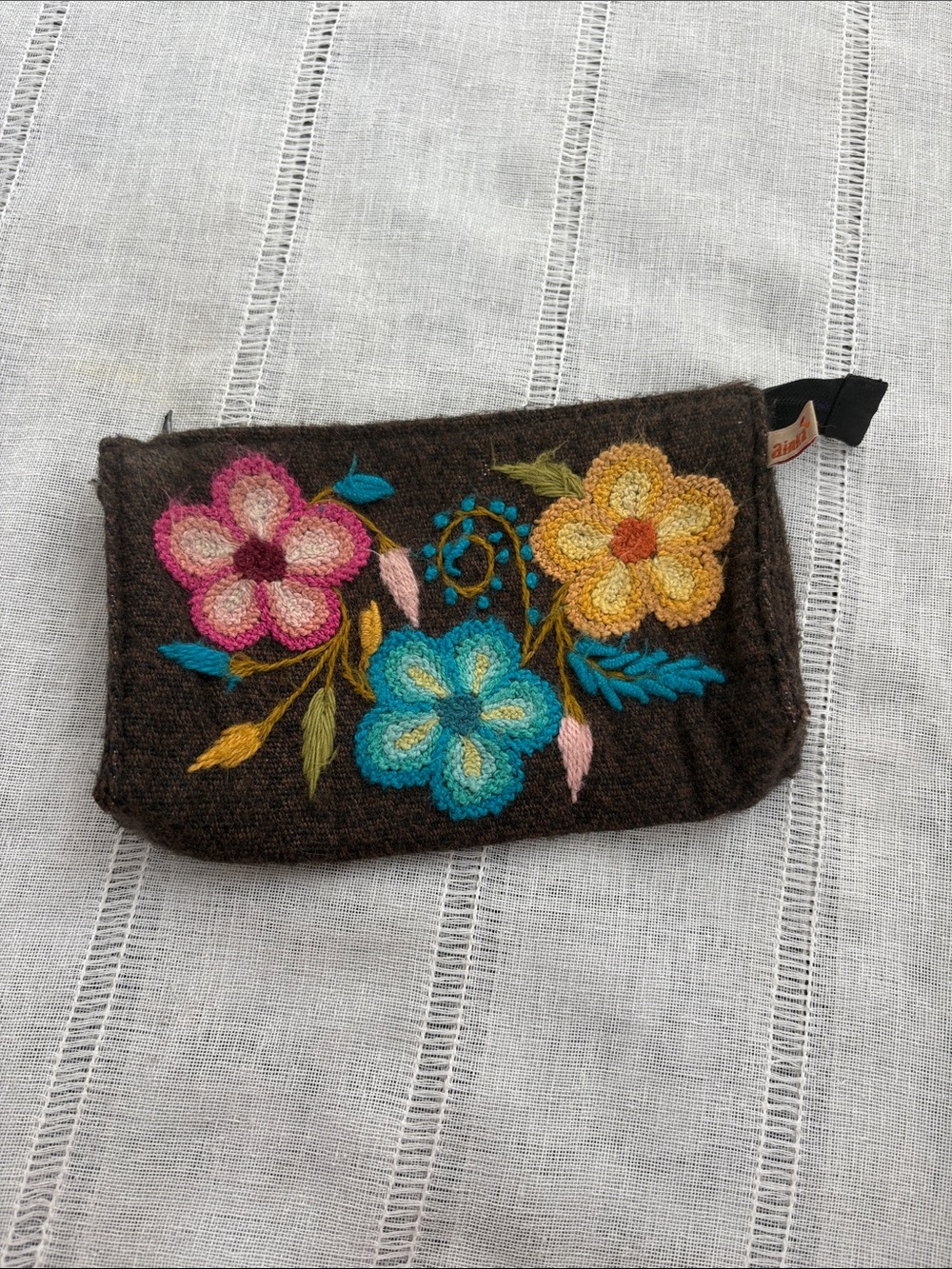 Anika Alpaca Clutch Pouch with Vibrant, Hand-embroidered Floral Motifs.